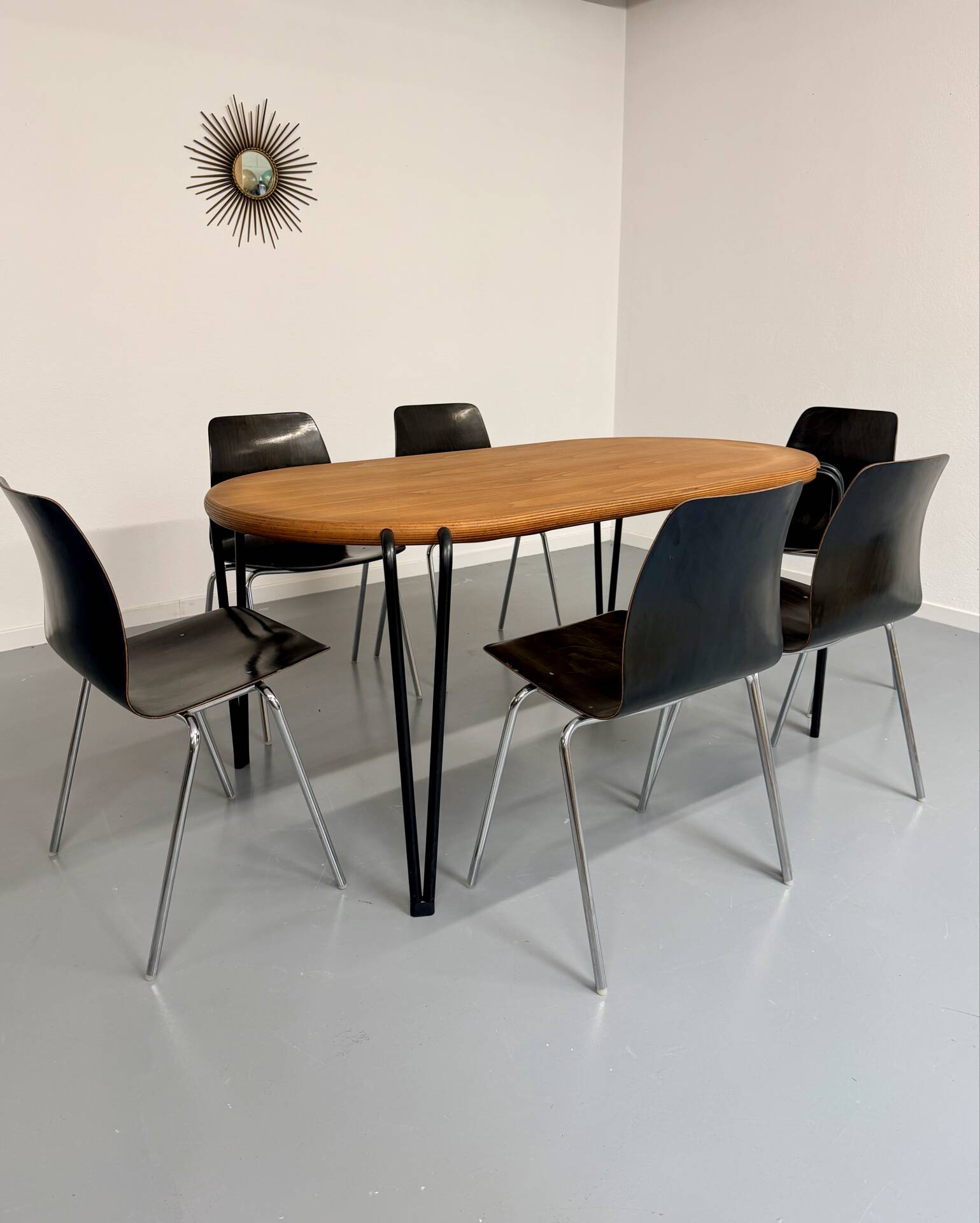 Solid wood dining table with tubular legs, 1980s postmodern design.