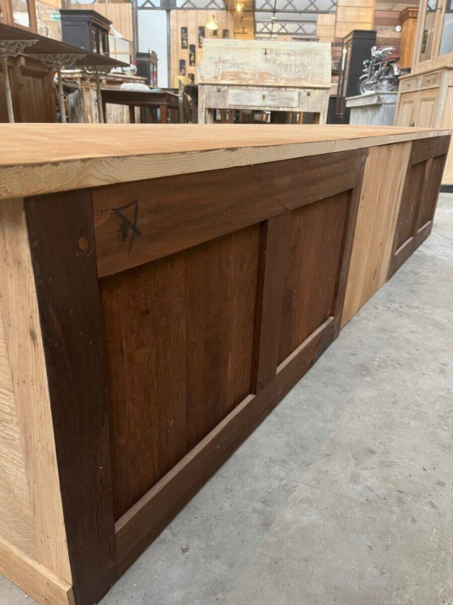 An old piece of workshop furniture transformed into a TV stand