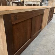 An old piece of workshop furniture transformed into a TV stand