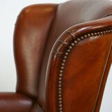 Magnifique fauteuil classique en peau de mouton avec une belle apparence et une assise confortable