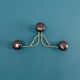 Golden brass coat rack with 3 black vintage hooks from the Mid Century 1950-60.