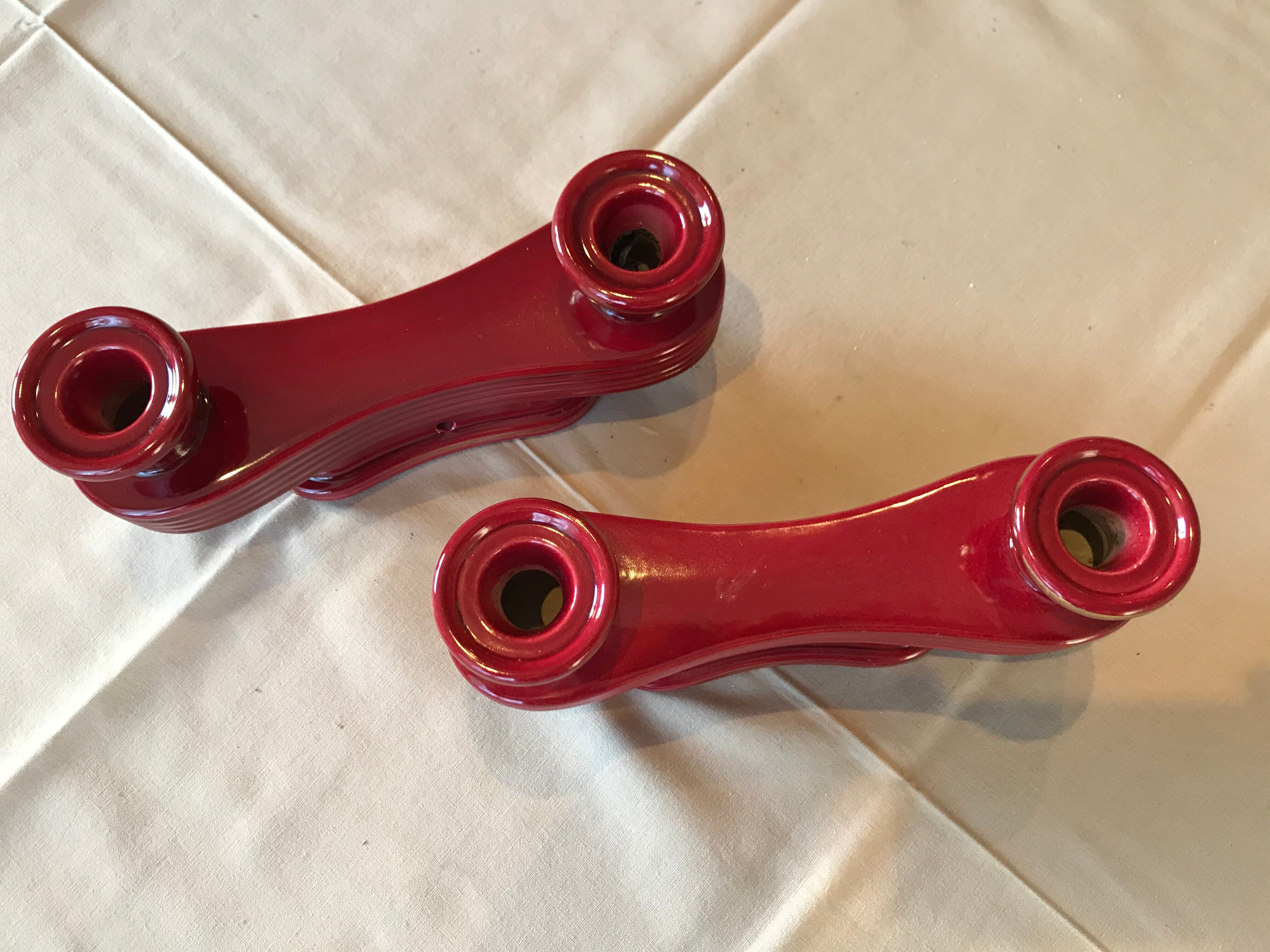 Two vintage raspberry candlesticks