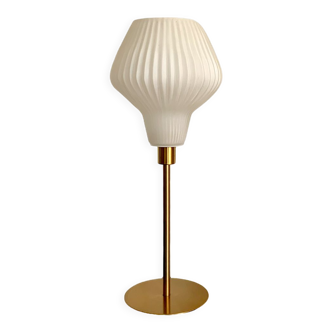 Table lamp with an antique vintage white glass lampshade, such as origami and a golden foot