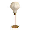 Table lamp with an antique vintage white glass lampshade, such as origami and a golden foot