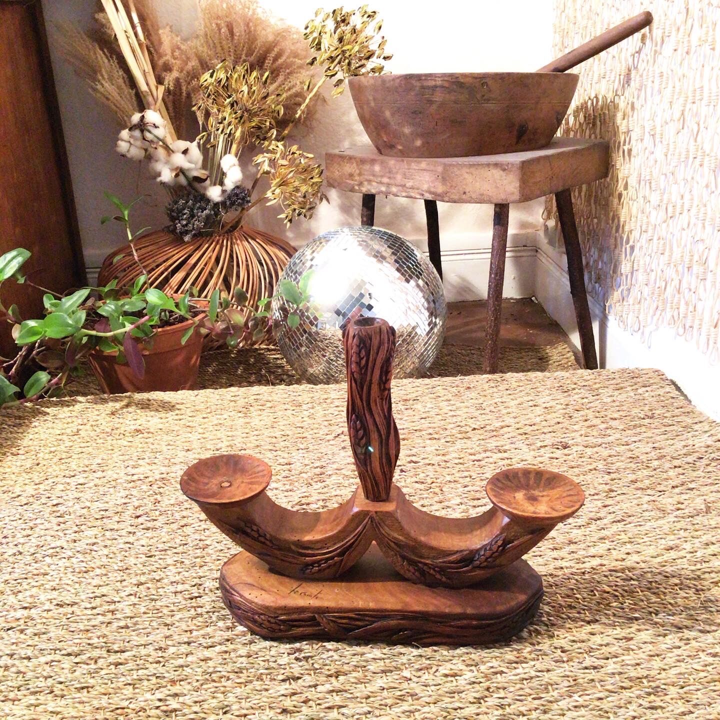 Carved wooden candle holder