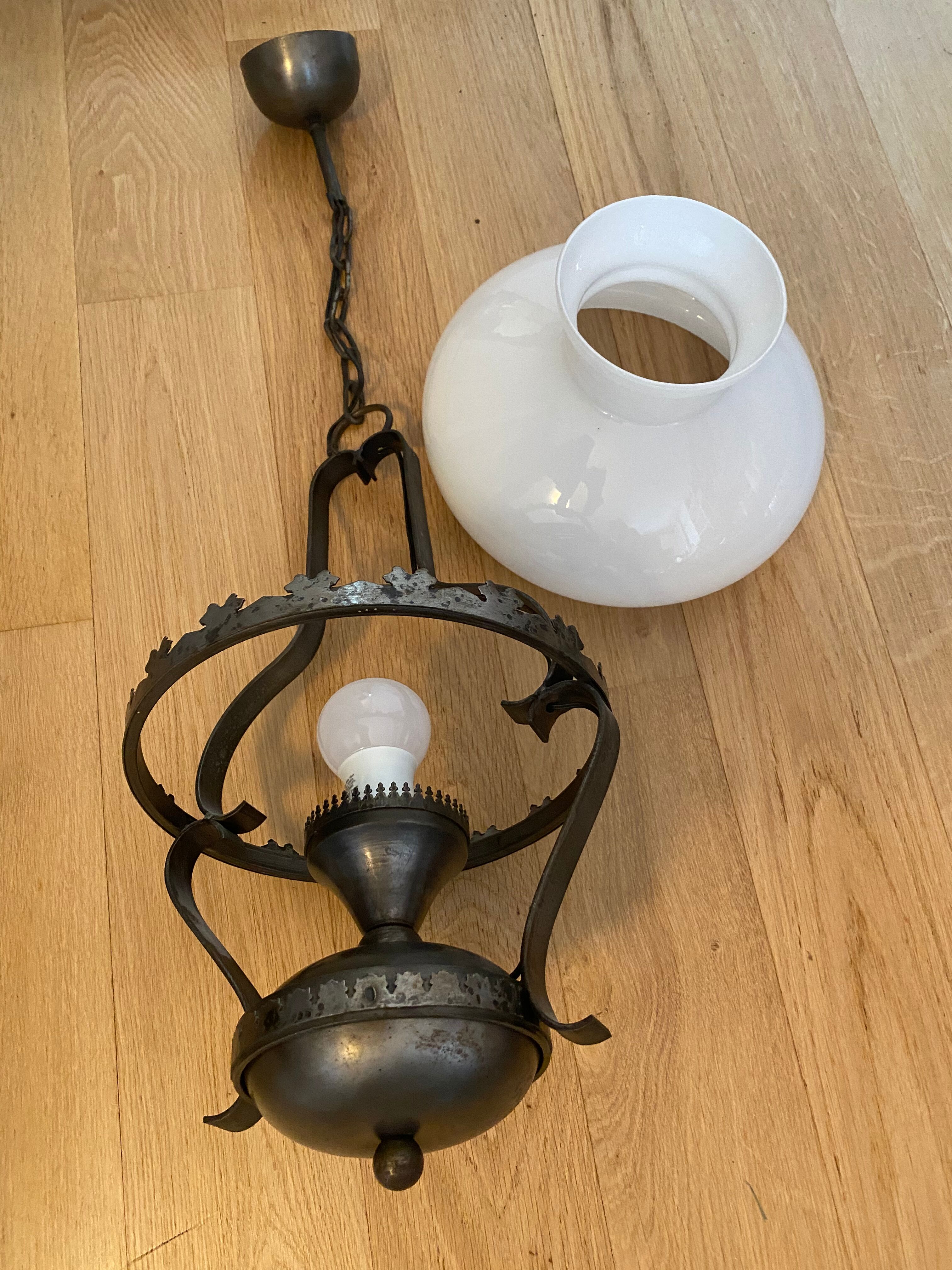 Metal chandelier and opaline glass gloss