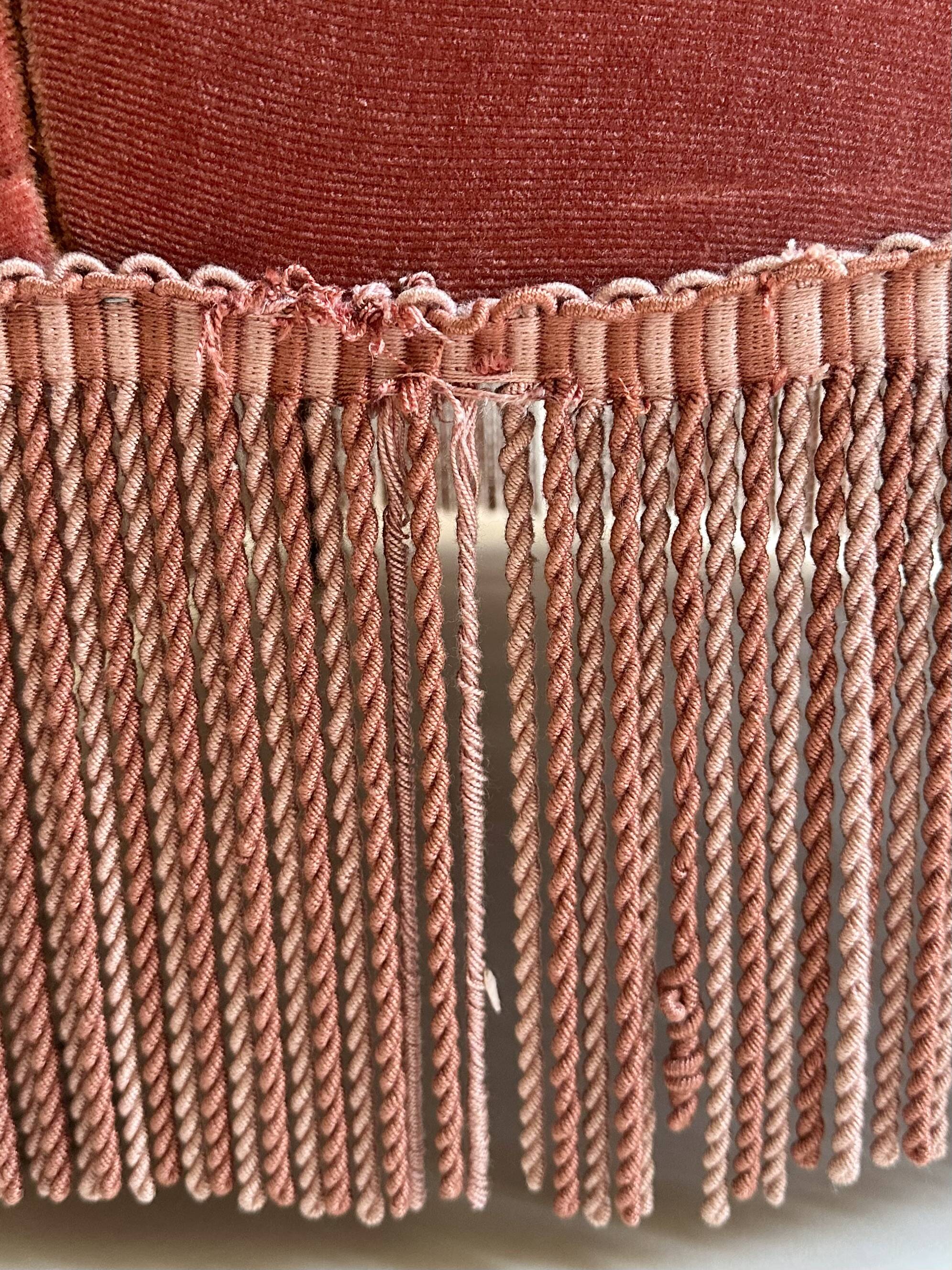 Pink-orange velvet tub chair