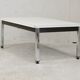 Coffee table chrome steel base, white melaminate top. France, circa 1970.