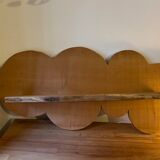 Cloud-shaped shelf made of solid wood