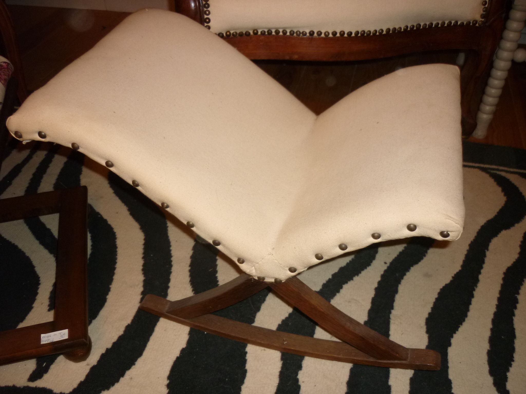 Armchair and its footrest