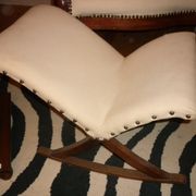 Armchair and its footrest