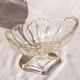 Oval glass fruit bowl on a stand.
