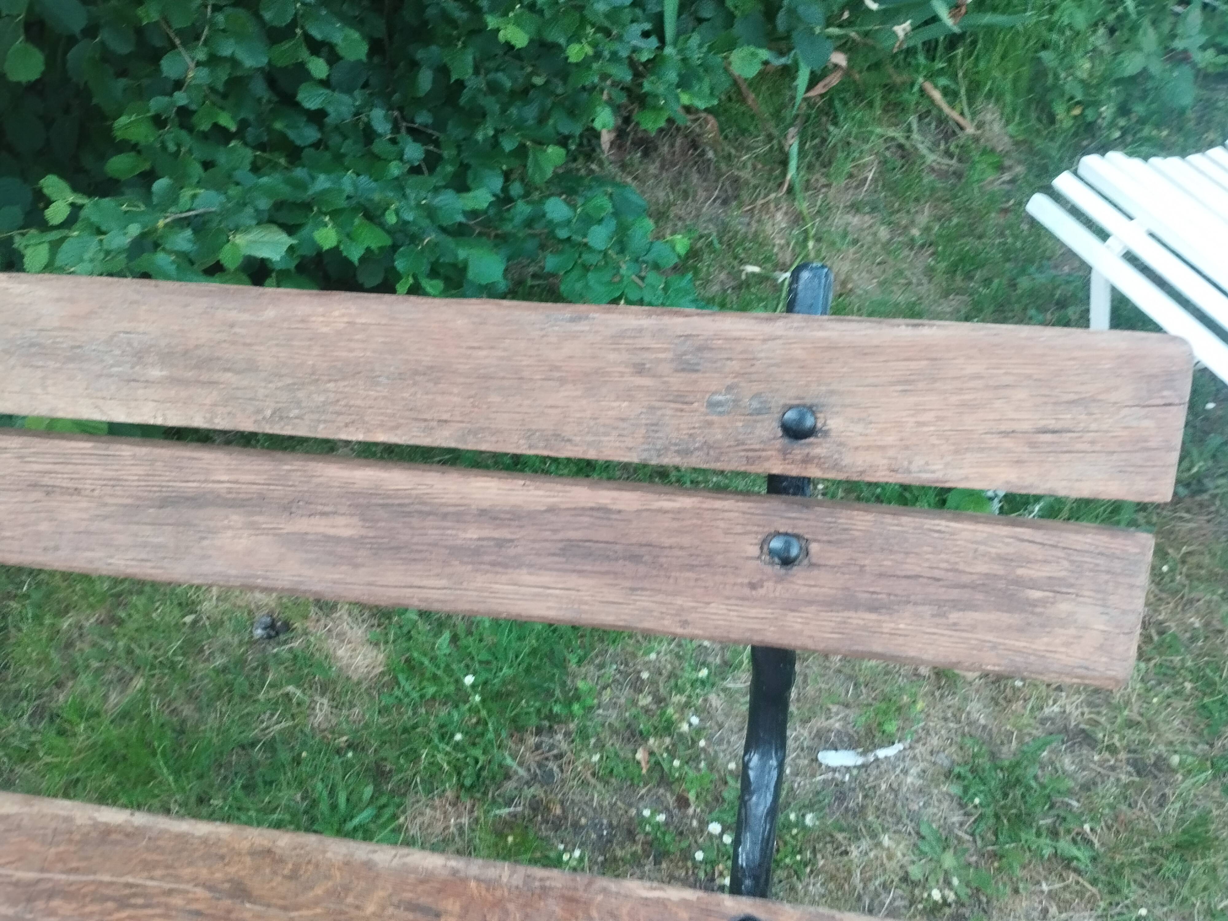 Antique garden bench with cast iron legs