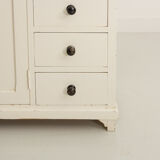 Small accent cabinet with drawers and swing doors