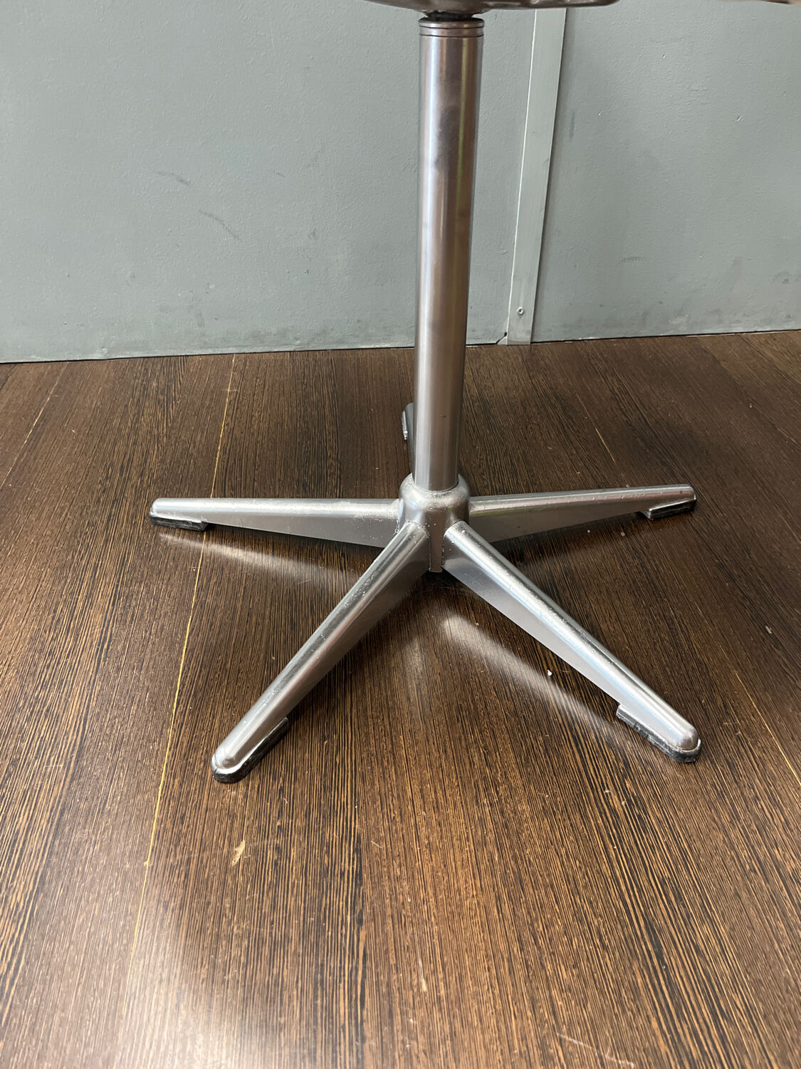 Old hairdressing chair and its footrest