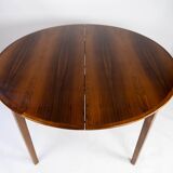 Dining table in rosewood with three extension plates, of danish design from the 1960s.