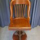 Swivel American chair in walnut and cast iron