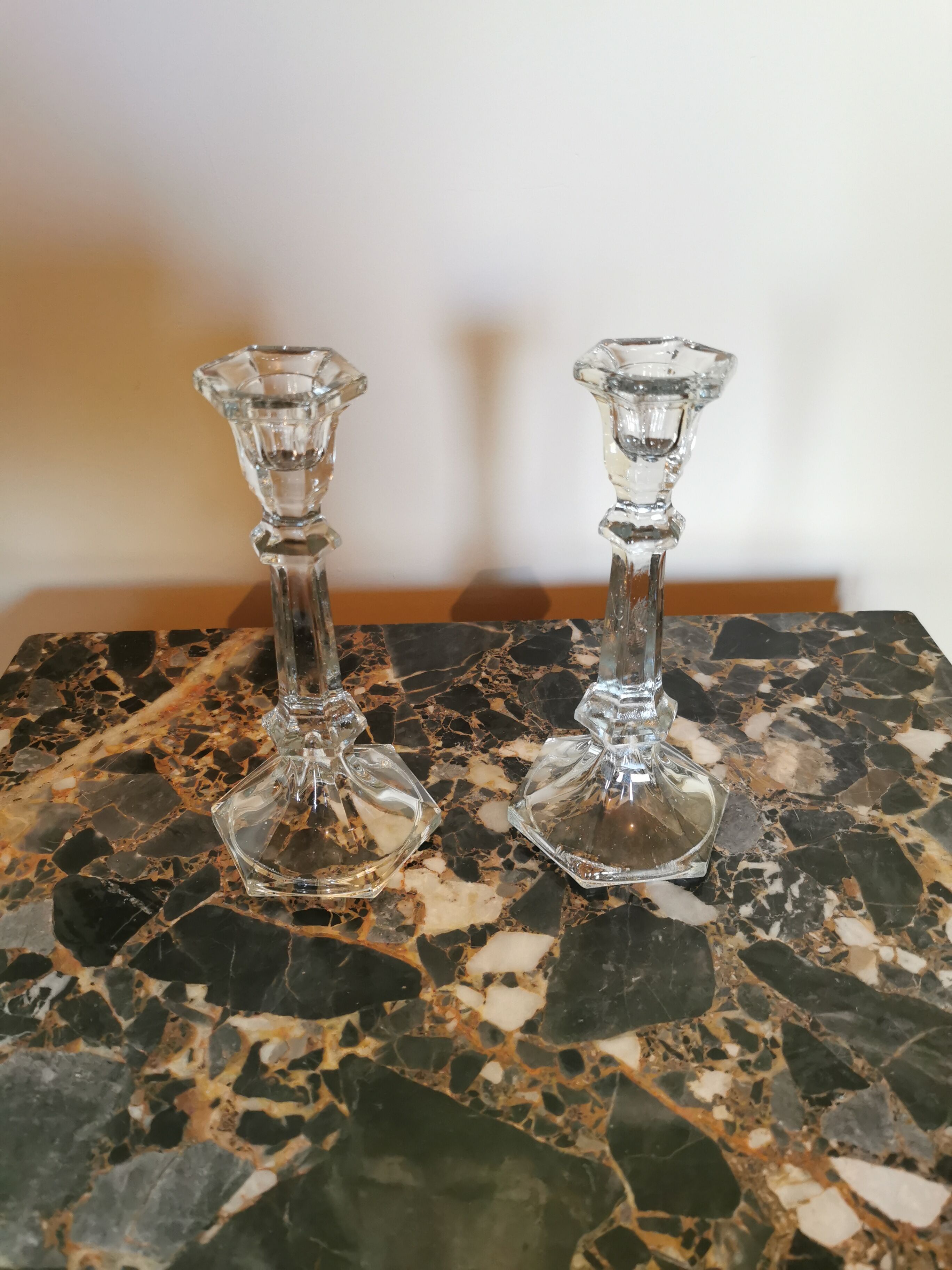 Pair of antique candle holders in transparent glass