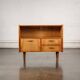 Old TV cabinet with brass handles.