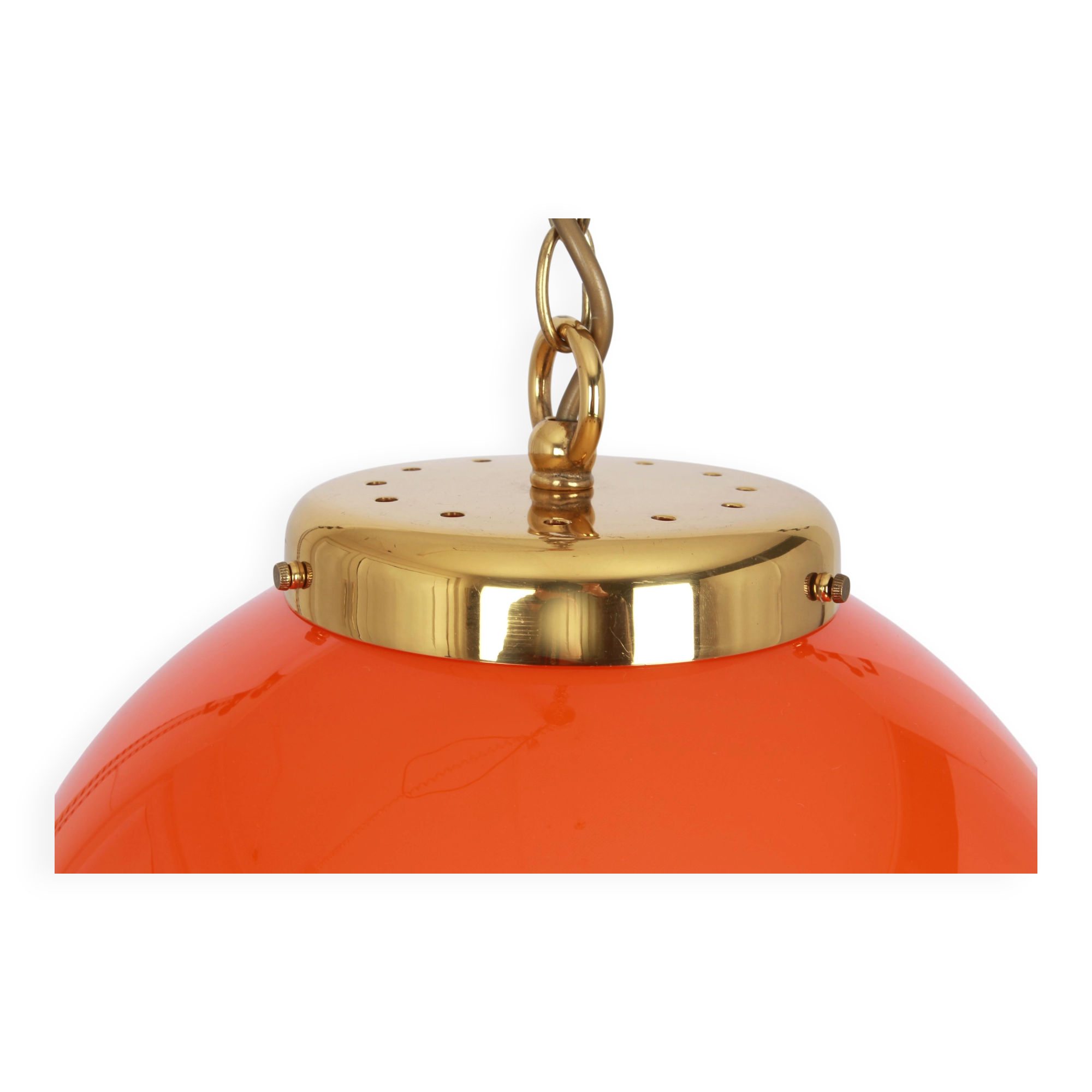 Orange glass pendant light by Peill Putzler, Germany, 1970.