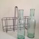 Pair of old milk bottles, tinted glass