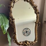 Rocaille style mirror from the 20th century in wood and gilded stucco, Putto on the pediment