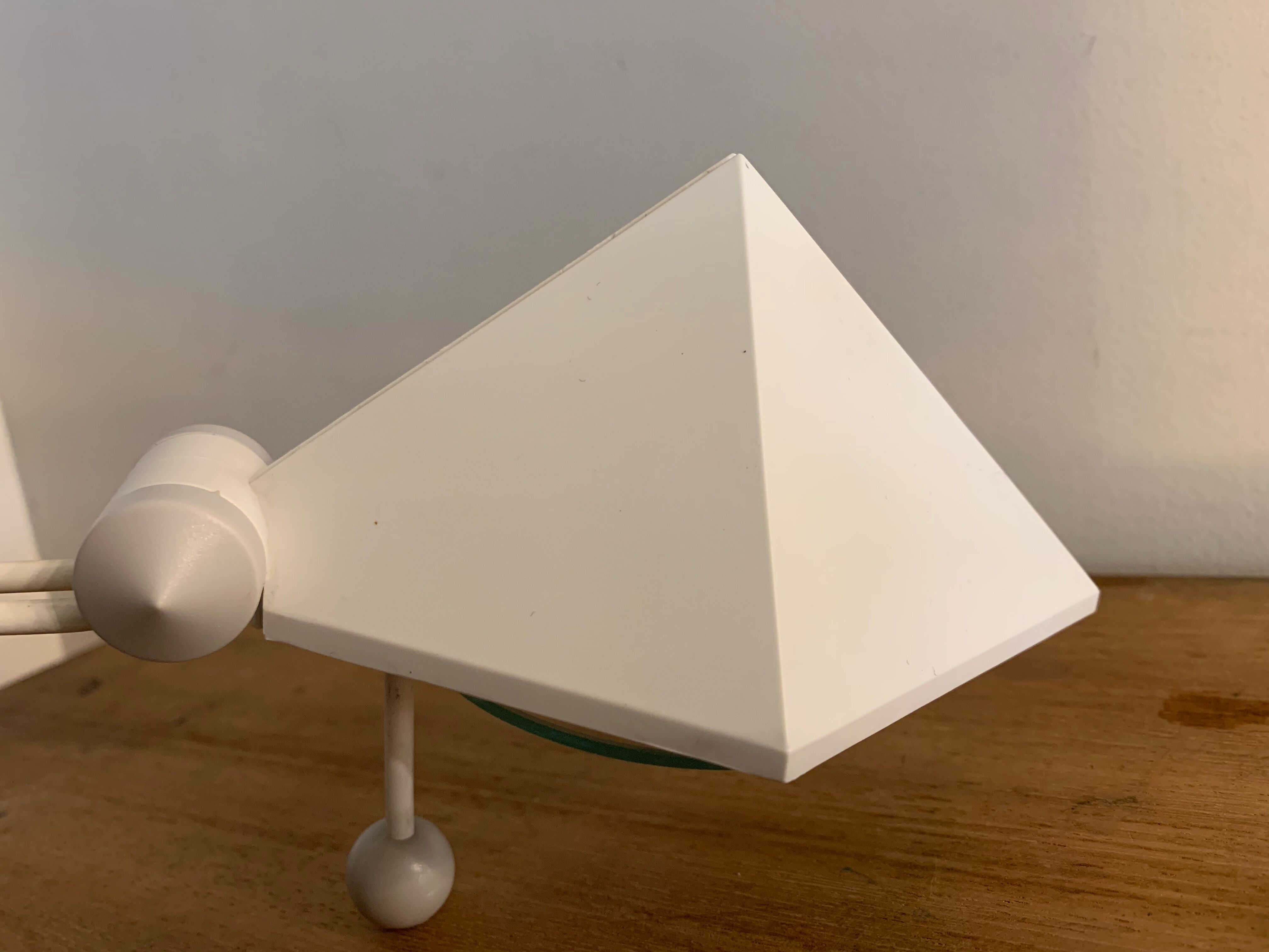White pyramid desk lamp embnched white pyramid Lungean and Pellmann 1980