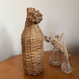 Bouteille en verre et rotin vintage