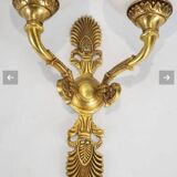 Paire d'appliques de style Empire en bronze doré et ciselé