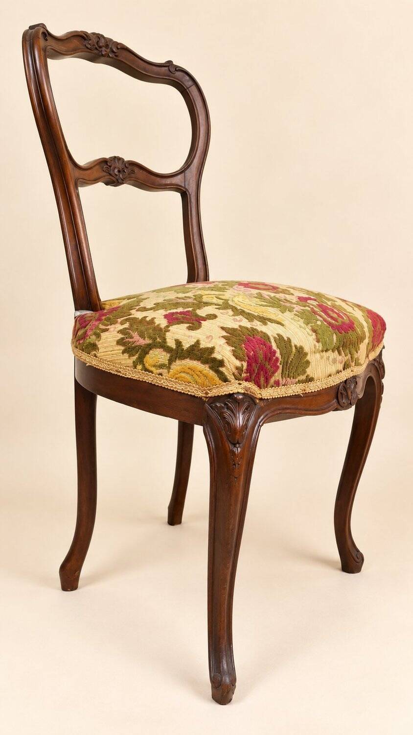 Carved walnut Napoleon III style velvet medallion chair