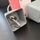 Set of 3 vintage 1950s pink and white plexiglass pendants.