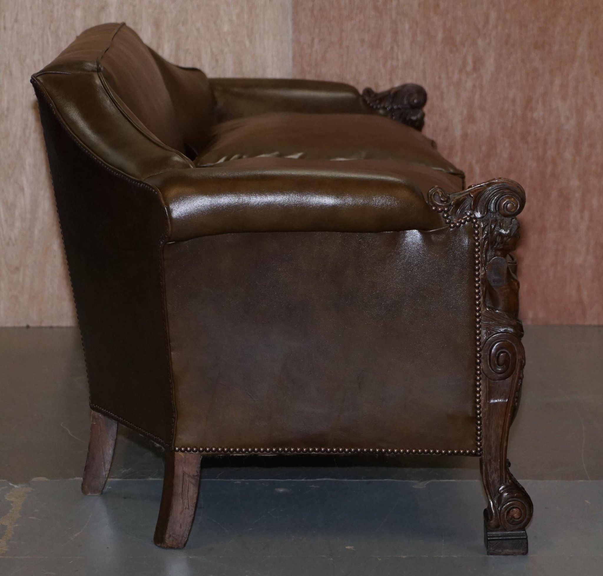 Restored Regency canapé in leather with sculpted Hermès frame.