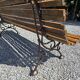 Wooden garden bench with cast iron base