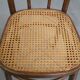 Bistro chair with a woven cane seat