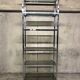 Design in metal chrome and smoked glass shelf