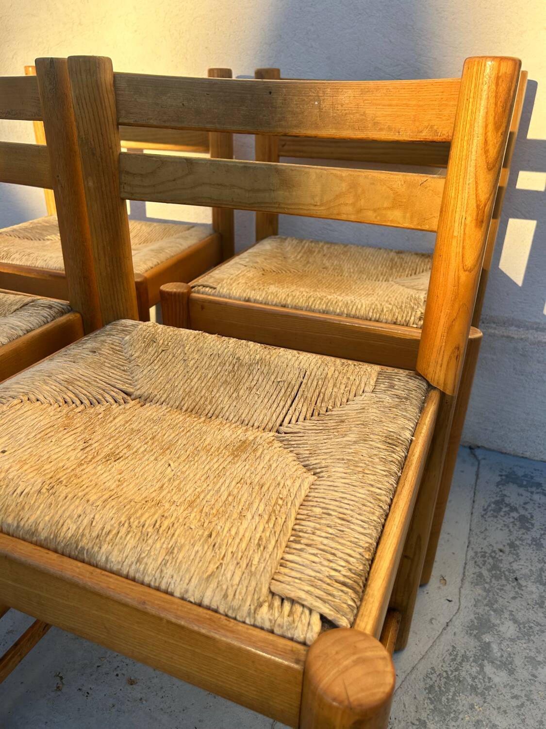 4 vintage chairs made of solid wood and woven straw