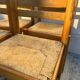 4 vintage chairs made of solid wood and woven straw