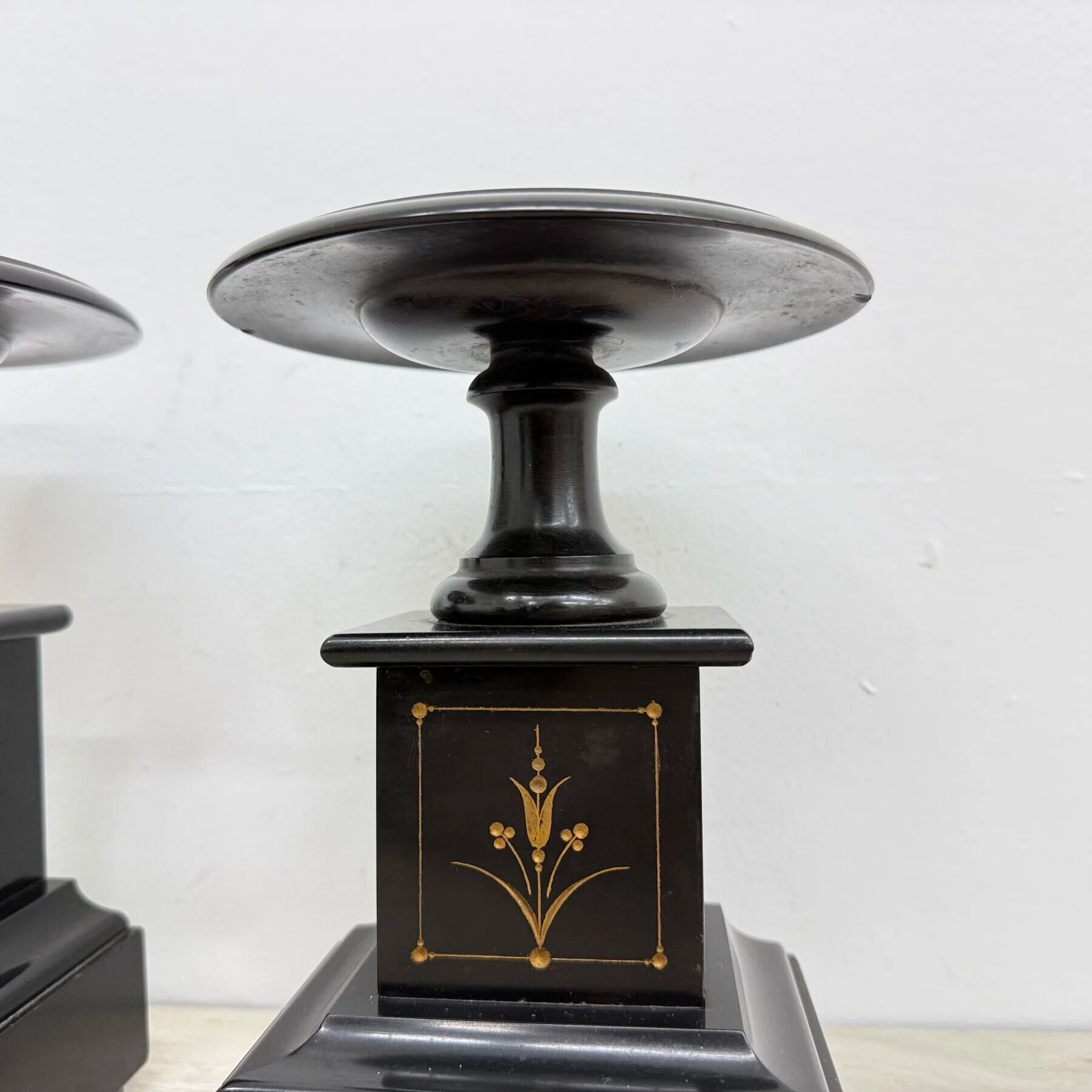 Antique French black marble cassoulets gilt decor pedestals neoclassical pair, 1900s