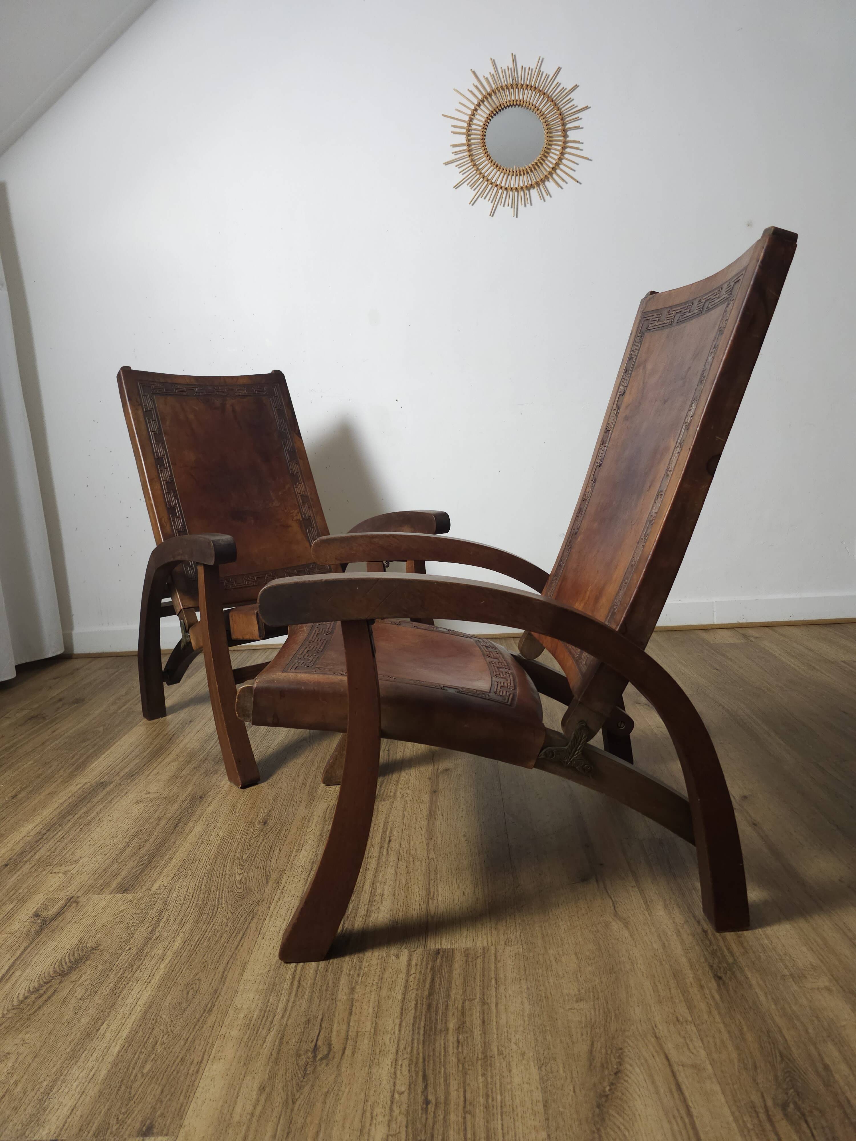 Leather and teak armchairs, by Angel Pazmino, circa 1960.