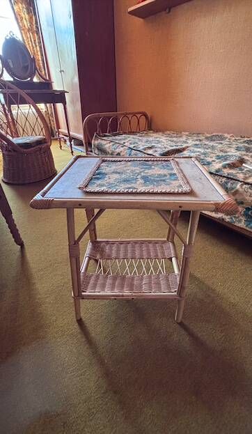 Vintage bedside table in bamboo and rattan with decorative top.