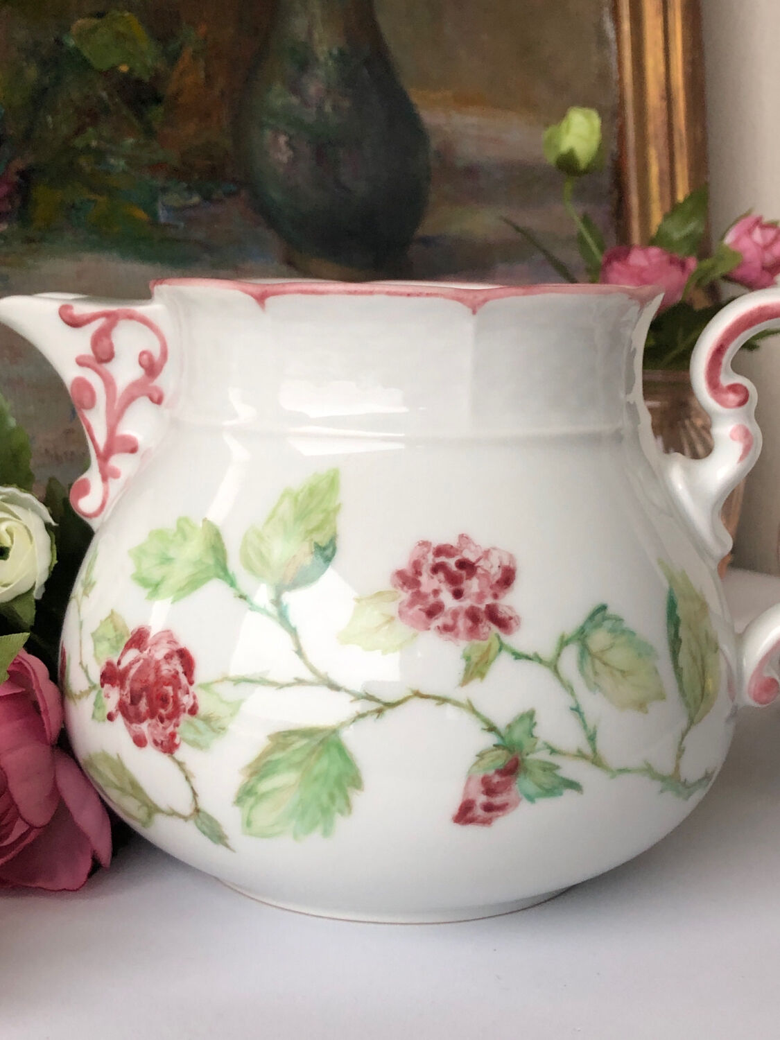 Old white and pink teapot