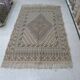 Traditional handmade Berber carpet in brown and beige wool.