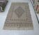 Traditional handmade Berber carpet in brown and beige wool.