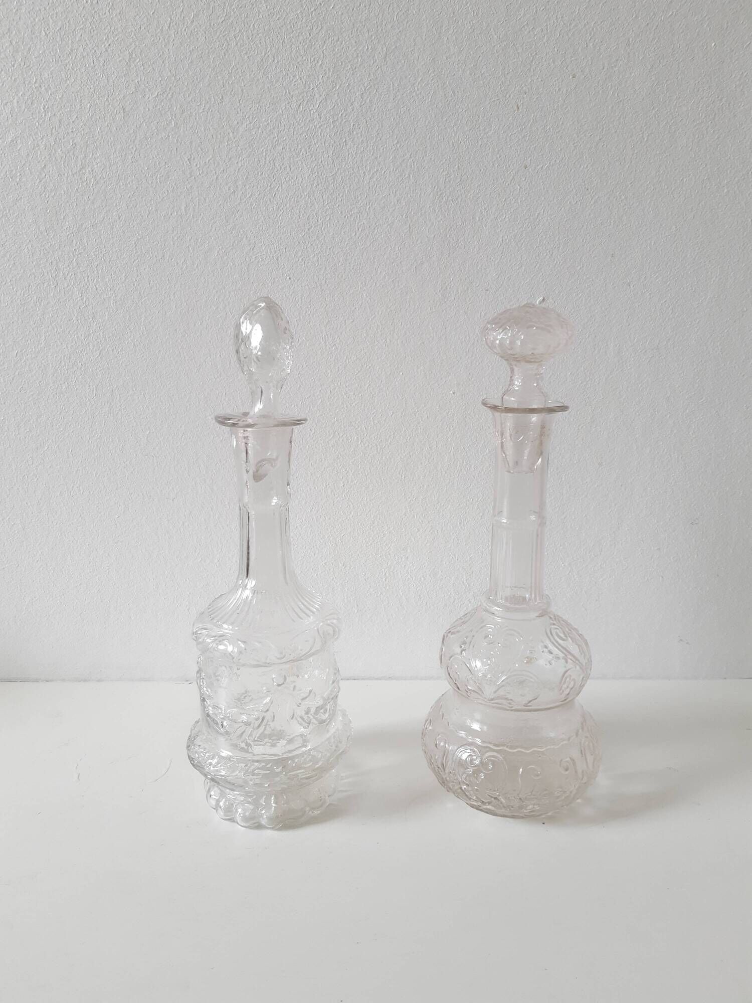 Set of 2 vintage carved glass bottles