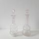 Set of 2 vintage carved glass bottles
