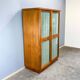 Art Deco cabinet with glass doors, various woods, 1930s