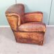 Leather nailed armchair