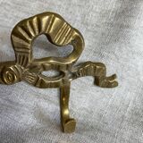 Two-hook coat rack with knot and ribbon in brass