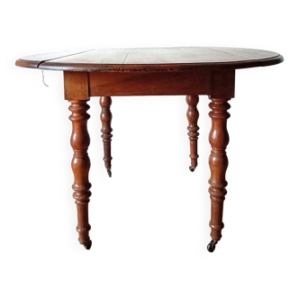 Oval table with flaps