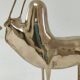 Two stylized zebu with long vintage brass horns